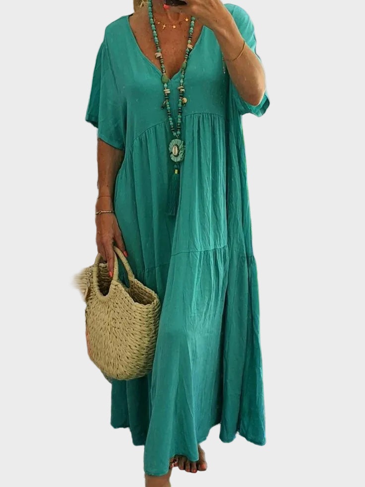 Linnea – Miękka maxi sukienka z falbanami i dekoltem w kształcie V